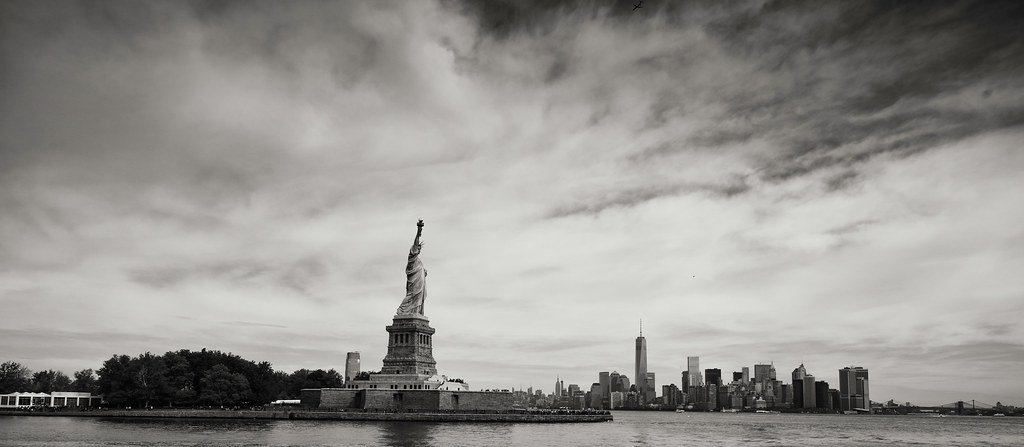 The Statue of Liberty against a city skyline, symbolizing U.S. immigration and citizenship